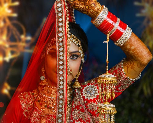 The 4 best video quality improvement software 1 Woman in Red and Gold Sari Dress